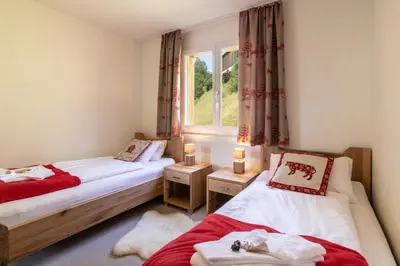 Ein Bett oder Betten in einem Zimmer der Unterkunft Chalet Hannegg Penthouse