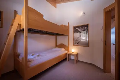 Ein Bett oder Betten in einem Zimmer der Unterkunft Chalet Aquila 7 Penthouse