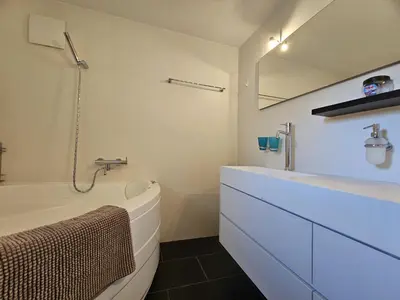 Ein Badezimmer in der Unterkunft Mountain Village 11