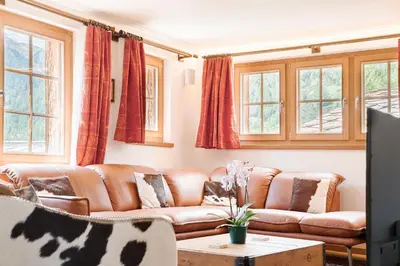 Ein Sitzbereich in der Unterkunft Chalet Ulysse