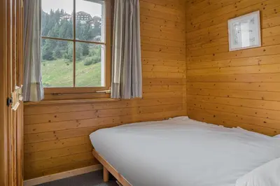 Ein Bett oder Betten in einem Zimmer der Unterkunft Tschiffra EG