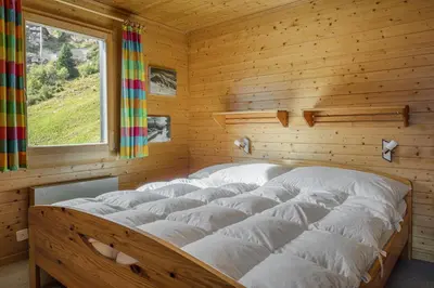 Ein Bett oder Betten in einem Zimmer der Unterkunft Tschiffra OG