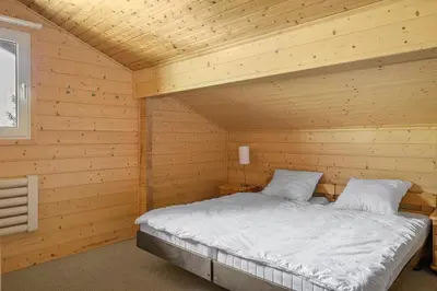Ein Bett oder Betten in einem Zimmer der Unterkunft Lotus OG