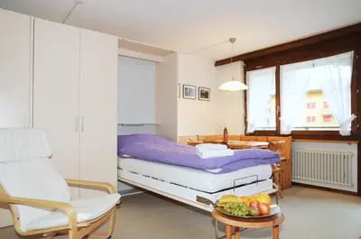 Ein Bett oder Betten in einem Zimmer der Unterkunft Alpenhaus Bettmeralp