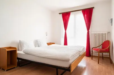 Ein Bett oder Betten in einem Zimmer der Unterkunft Hotel Schwarzsee