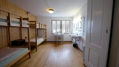 Ein Bett oder Betten in einem Zimmer der Unterkunft Leissigen Youth Hostel