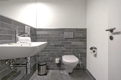 Ein Badezimmer in der Unterkunft Apartment JungfrauCenter Brienzersee - GRIWA RENT