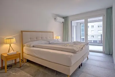 Ein Bett oder Betten in einem Zimmer der Unterkunft Apartment JungfrauCenter Schynige Platte - GRIWA RENT AG