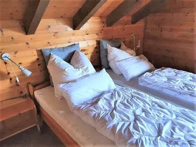 Ein Bett oder Betten in einem Zimmer der Unterkunft Wallisblick
