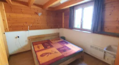 Ein Bett oder Betten in einem Zimmer der Unterkunft Wallisblick