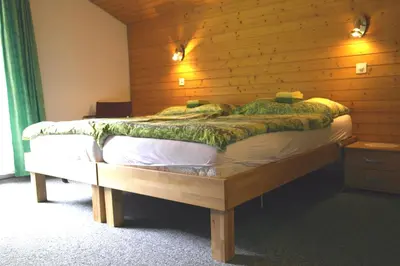 Ein Bett oder Betten in einem Zimmer der Unterkunft Hotel-Restaurant Stechelberg Bed & Breakfast