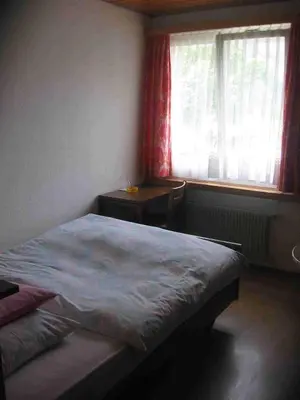 Ein Bett oder Betten in einem Zimmer der Unterkunft Hotel-Restaurant Stechelberg Bed & Breakfast