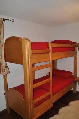 Ein Bett oder Betten in einem Zimmer der Unterkunft Les Petits Mélèzes