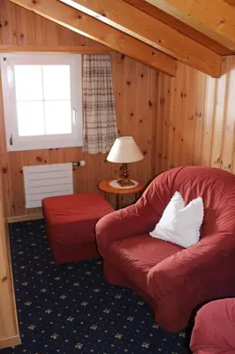 Ein Sitzbereich in der Unterkunft Chalet Spinne