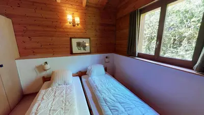 Ein Bett oder Betten in einem Zimmer der Unterkunft Tschuggen 24