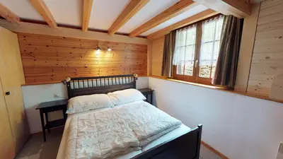 Ein Bett oder Betten in einem Zimmer der Unterkunft Tschuggen 61