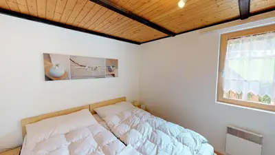 Ein Bett oder Betten in einem Zimmer der Unterkunft Chämihitta