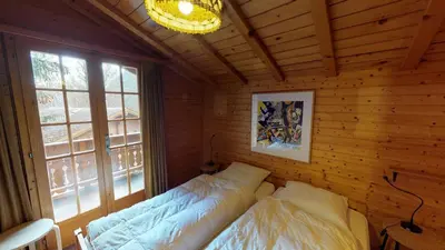 Ein Bett oder Betten in einem Zimmer der Unterkunft Numaga