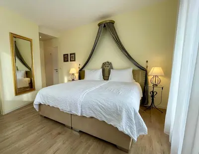 Ein Bett oder Betten in einem Zimmer der Unterkunft Hotel Movieworld