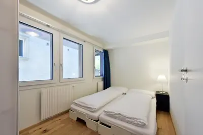 Ein Bett oder Betten in einem Zimmer der Unterkunft Ferienlenk Mountain Village