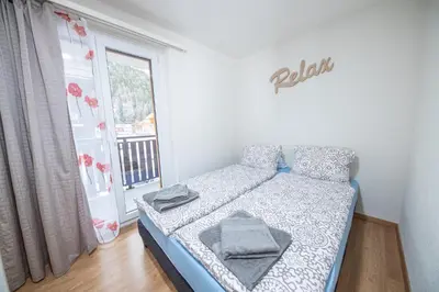 Ein Bett oder Betten in einem Zimmer der Unterkunft Haus Astoria