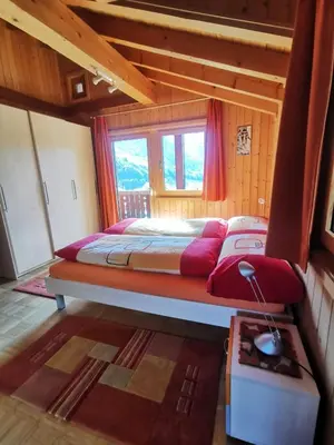 Ein Bett oder Betten in einem Zimmer der Unterkunft Chalet Edi