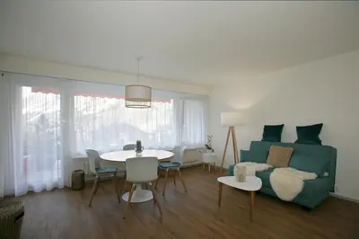 Ein Sitzbereich in der Unterkunft Apartments Haus Quelle
