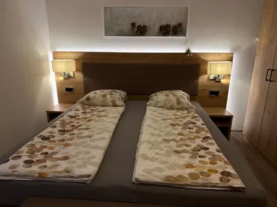 Ein Bett oder Betten in einem Zimmer der Unterkunft Haus Les Mélèzes C