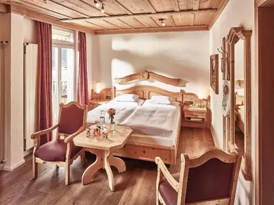 Ein Bett oder Betten in einem Zimmer der Unterkunft Hotel Schönegg