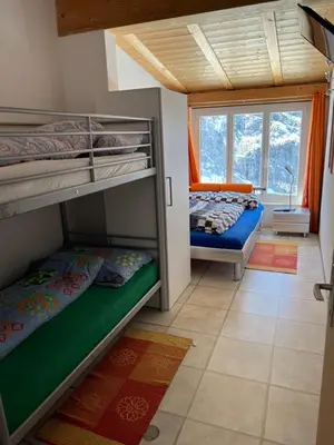 Ein Bett oder Betten in einem Zimmer der Unterkunft Berghotel Furggstalden