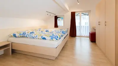 Ein Bett oder Betten in einem Zimmer der Unterkunft Chalet Alpenrösli