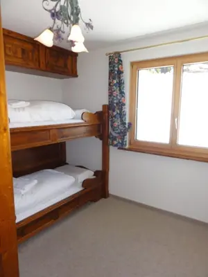 Ein Bett oder Betten in einem Zimmer der Unterkunft Apartment Weisshorn