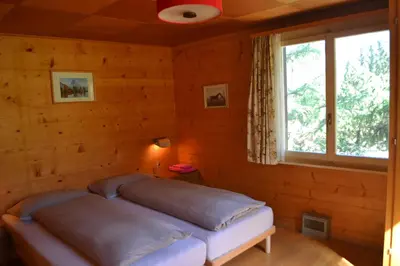 Ein Bett oder Betten in einem Zimmer der Unterkunft Chalet Minga Mal