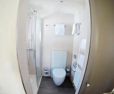 Ein Badezimmer in der Unterkunft Alpina