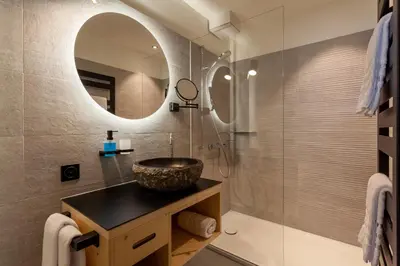 Ein Badezimmer in der Unterkunft Sonne Andermatt Swiss Quality Hotel