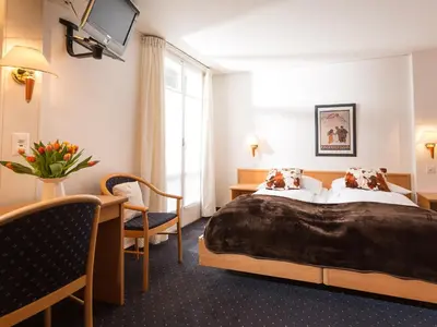 Ein Bett oder Betten in einem Zimmer der Unterkunft Hotel Oberland