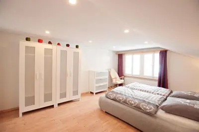 Ein Bett oder Betten in einem Zimmer der Unterkunft 2BR apartment close to ski area and Jungfrau train