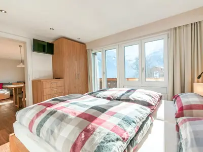 Ein Bett oder Betten in einem Zimmer der Unterkunft Apartment Chalet Bodmisunne-2 by Interhome