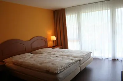 Ein Bett oder Betten in einem Zimmer der Unterkunft Welcome Hotel Täsch by Täscherhof