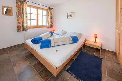 Ein Bett oder Betten in einem Zimmer der Unterkunft Försterli West