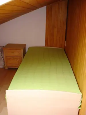 Ein Bett oder Betten in einem Zimmer der Unterkunft Chalet Sunneschyn