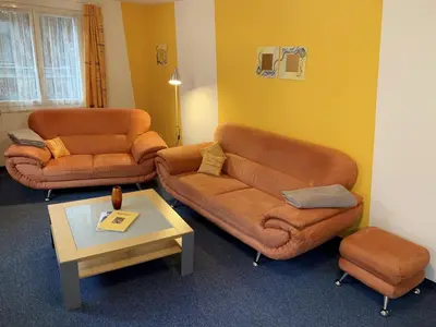 Ein Sitzbereich in der Unterkunft Domblick Apartments