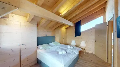 Ein Bett oder Betten in einem Zimmer der Unterkunft Be Cool SAUNA & LUXURY chalet 10 pers by Alpvision Résidences