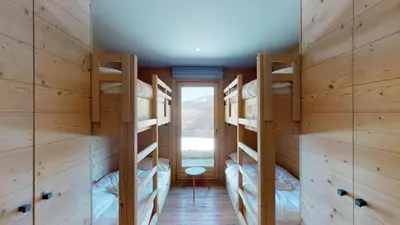 Ein Bett oder Betten in einem Zimmer der Unterkunft Be Cool SAUNA & LUXURY chalet 10 pers by Alpvision Résidences