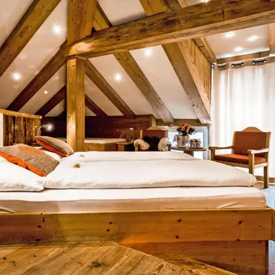Ein Bett oder Betten in einem Zimmer der Unterkunft Lifestyle & Spa Hotel Grächerhof