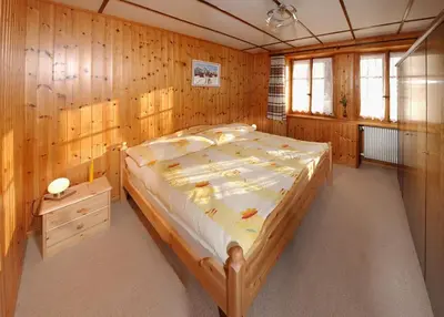 Ein Bett oder Betten in einem Zimmer der Unterkunft Chalet Heimetli