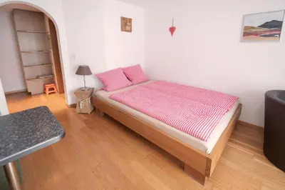 Ein Bett oder Betten in einem Zimmer der Unterkunft MOM - Alpine Boutique Apartments, Chalet Fagus, Terrace Studio