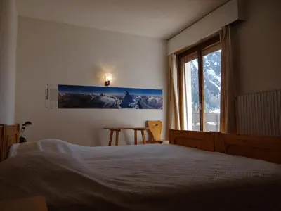 Ein Bett oder Betten in einem Zimmer der Unterkunft Les Arolles