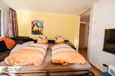 Ein Bett oder Betten in einem Zimmer der Unterkunft Wohnung in Zermatt mit postkarten Matterhornblick