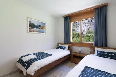 Ein Bett oder Betten in einem Zimmer der Unterkunft Apartment Arven